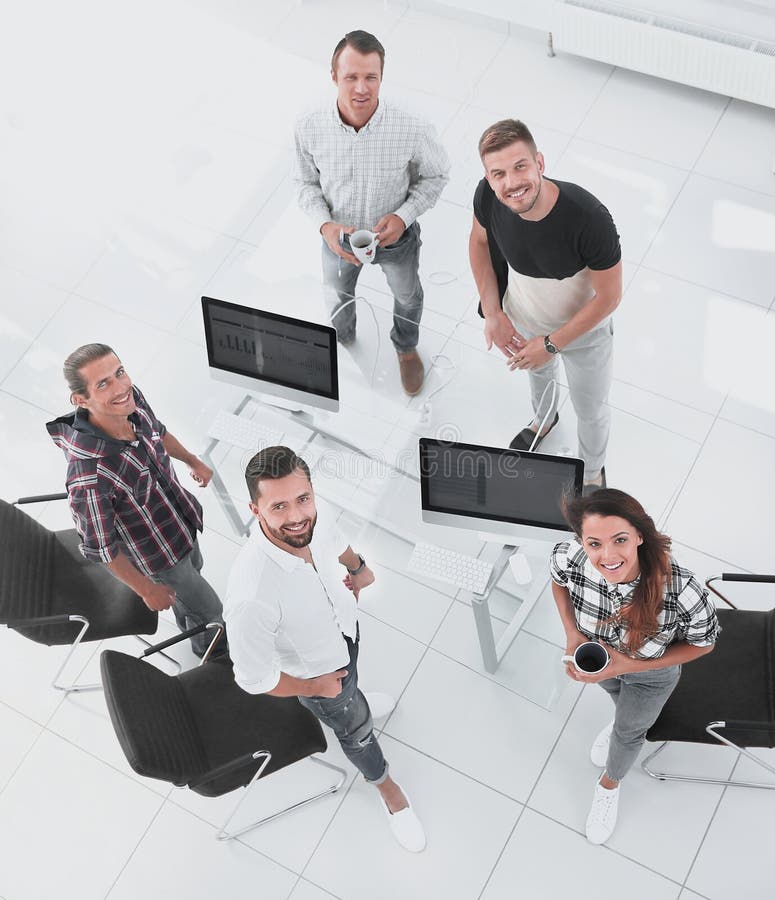 Employees of travel agencies standing in office stock photo Employees of travel agencies standing in office stock photo