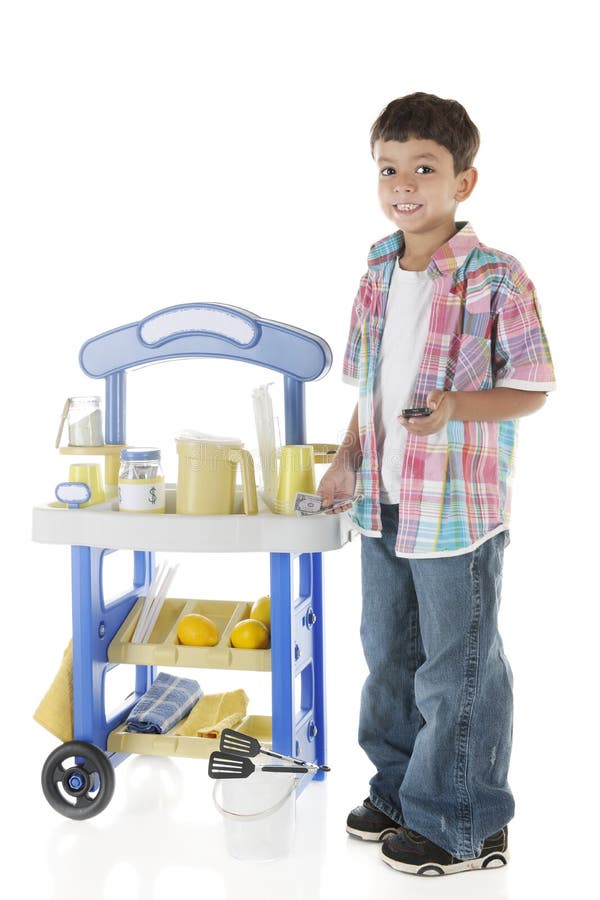 An adorable preschooler proudly standing by his lemonade stand with some of his earnings in his hand. On a white background. An adorable preschooler proudly standing by his lemonade stand with some of his earnings in his hand. On a white background.