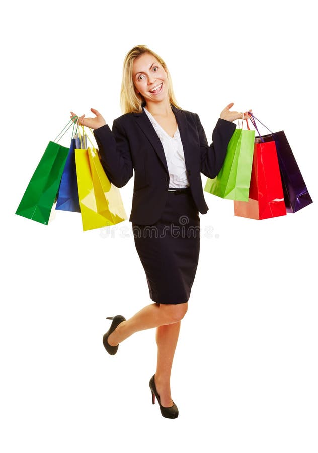 Empresaria de risa con los bolsos de compras fotografía de archivo libre de regalías Empresaria de risa con los bolsos de compras fotografía de archivo libre de regalías
