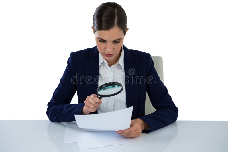 Businesswoman looking at document through magnifying glass against white background. Businesswoman looking at document through magnifying glass against white background