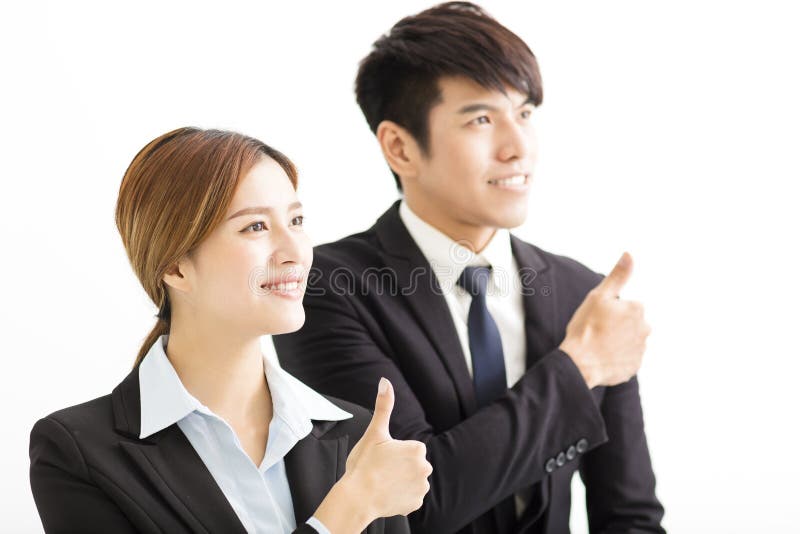 Empresaria y hombre de negocios sonrientes con los pulgares para arriba imágenes de archivo libres de regalías Empresaria y hombre de negocios sonrientes con los pulgares para arriba imágenes de archivo libres de regalías