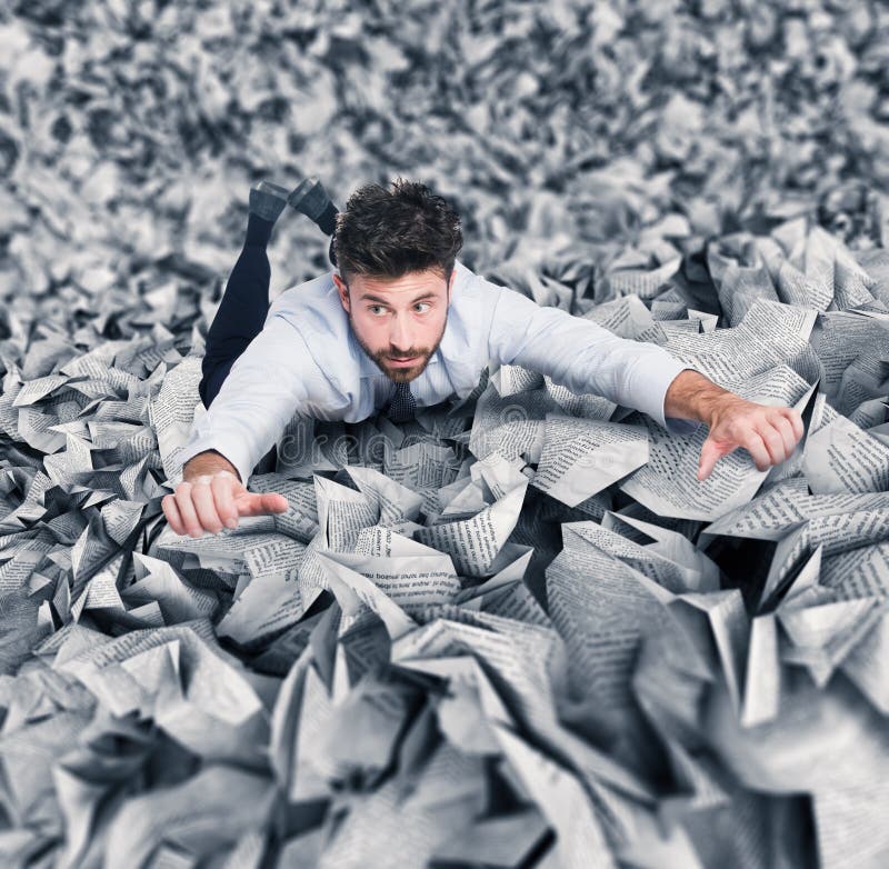 Businessman trying to escape from a pile of paperwork. Businessman trying to escape from a pile of paperwork