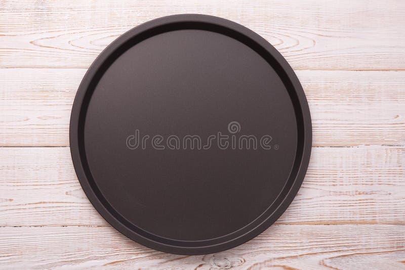 Empty baking tray for pizza on wooden table top view square. royalty free stock images Empty baking tray for pizza on wooden table top view square. royalty free stock images