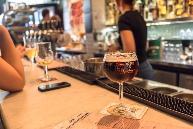 BRUSSELS, BELGIUM: Bar with some visitors, drinking local craft beer on April 2 2018. More than 1,200,000 people lives in Brussels. BRUSSELS, BELGIUM: Bar with some visitors, drinking local craft beer on April 2 2018. More than 1,200,000 people lives in Brussels