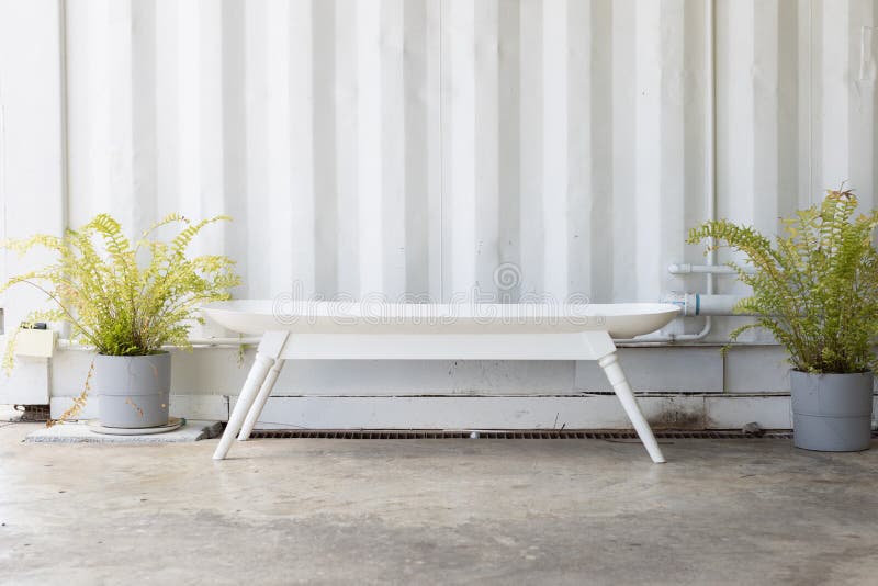 Empty bathtub bench or tub seat with sheet metal corrugated wall background stock images Empty bathtub bench or tub seat with sheet metal corrugated wall background stock images