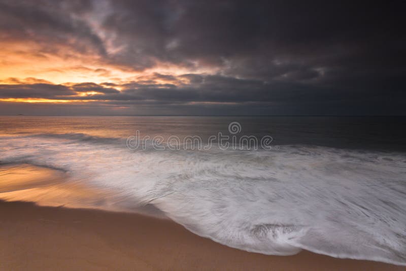 Empty beach at sunset