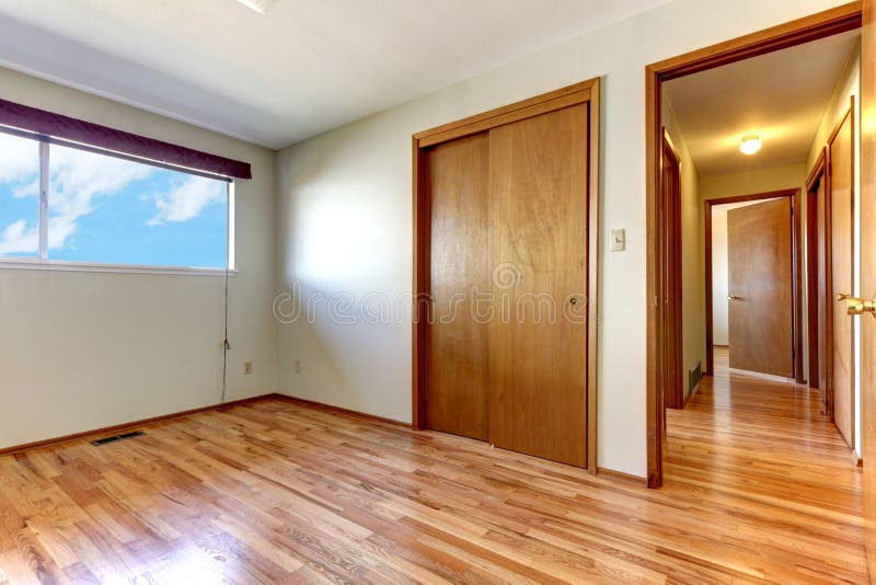 Empty Bedroom with Shiny Hardwood Floor. Stock Image - Image of