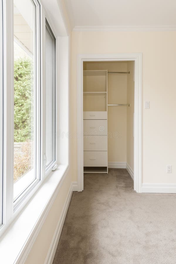 Empty bedroom with window and closet stock photo Empty bedroom with window and closet stock photo