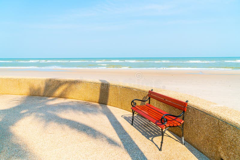 Empty bench at empty beach stock photo. Image of wave - 19025812
