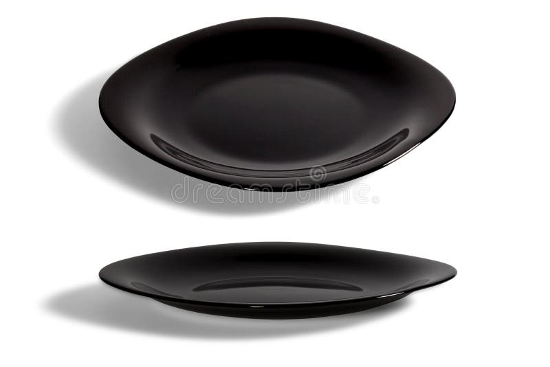 Black Dish On The Brown Table With Cutlery Meaning FINISHED Stock Image