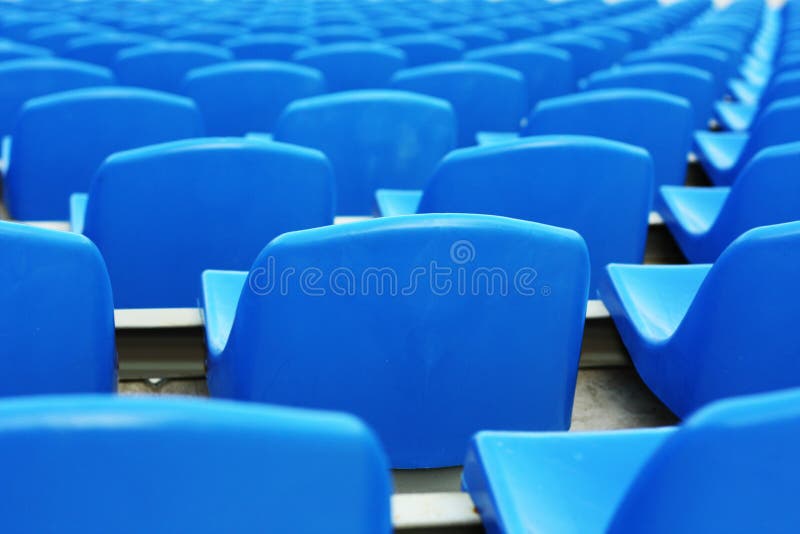 Empty blue plastic stadium seats