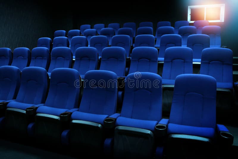 Empty blue seats in auditorium or movie theater