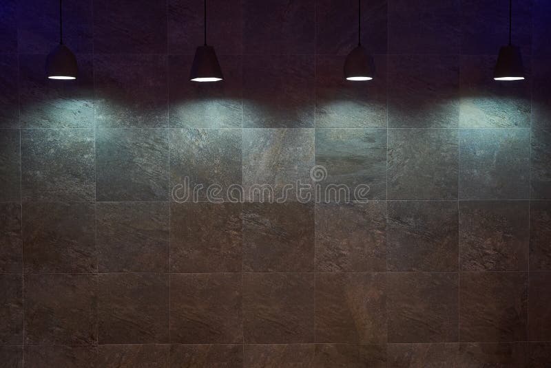 Empty brown tile wall background with lamps royalty free stock photos