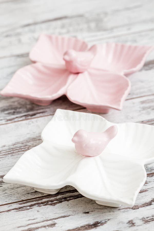Empty Ceramic Snack Plates with Bird Design on White Background Stock