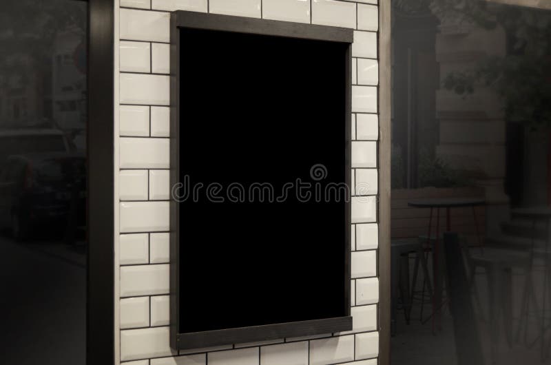 Empty chalkboard in restaurant or coffee shop for logo, identity, branding promotion royalty free stock images Empty chalkboard in restaurant or coffee shop for logo, identity, branding promotion royalty free stock images