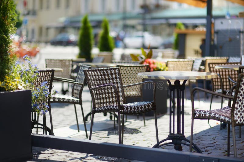 Empty chiars in outdoor cafe on summer day