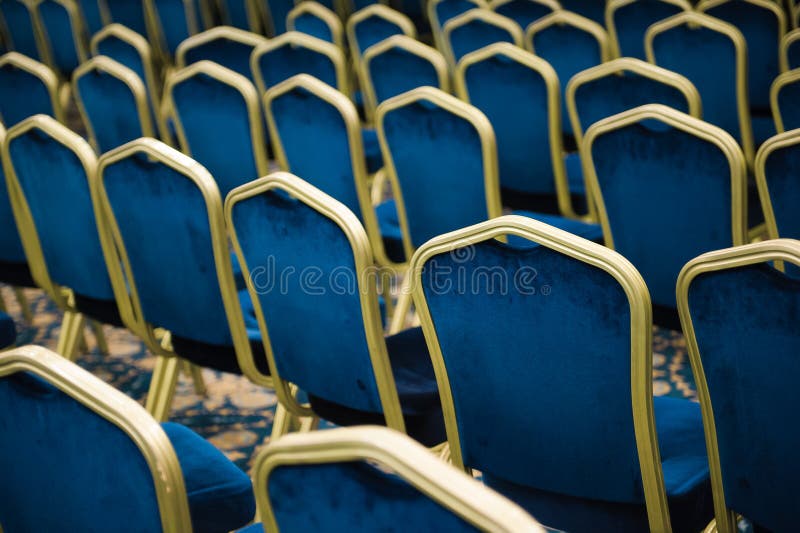 Empty cinema or theater auditorium, chairs befor meeting.