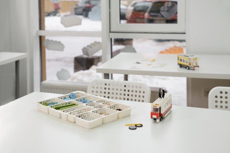 Empty class in school after STEM lessons interior. Empty class in school after science lessons. Tables in the room with handmade toys, nobody. Copy space. STEM constructing. Preschool Education for children. Engineering Classroom interior