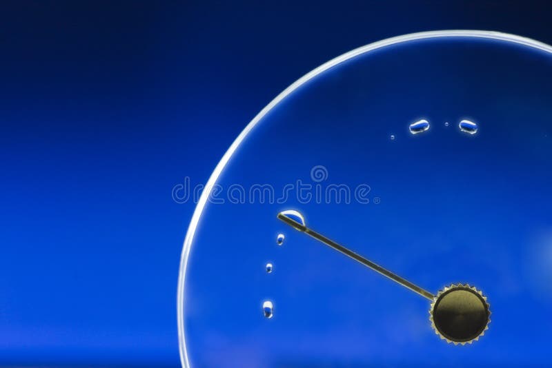 Empty clock lid with drop. Plexiglas cover of clockwork with metal knob and dial with lots of water drops, concept passing