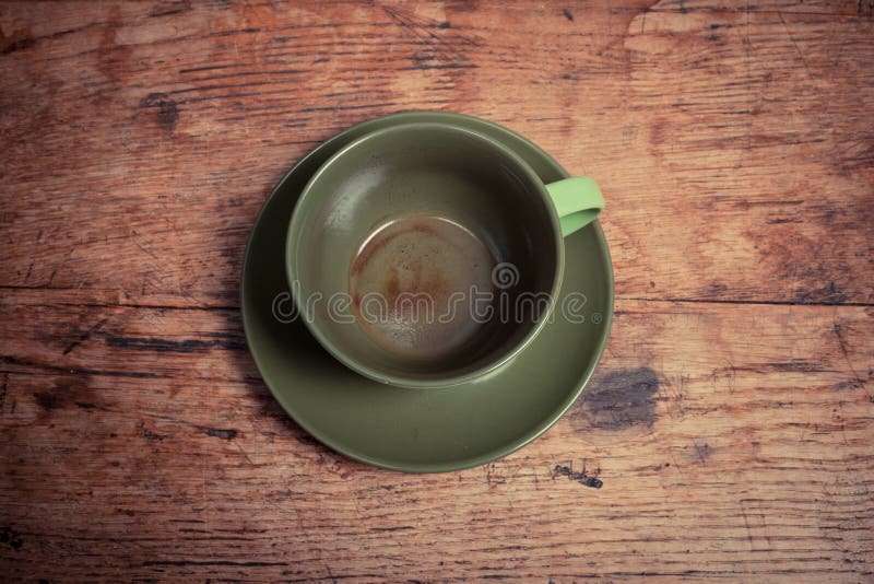 Empty cup on wooden table
