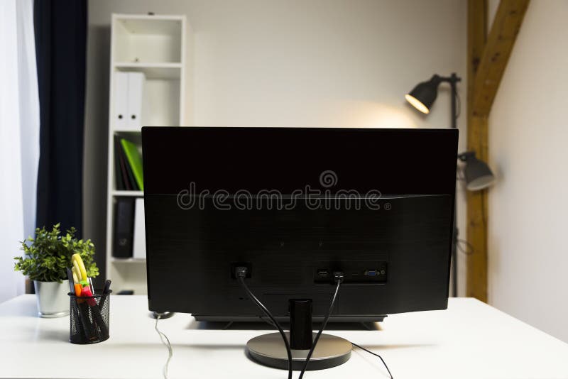 Empty desk with computer in office