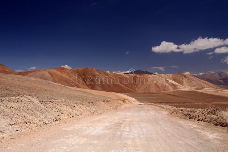 Empty dirt road to colorful Copiapo mountains in Atacama desert, Chile royalty free stock photos Empty dirt road to colorful Copiapo mountains in Atacama desert, Chile royalty free stock photos