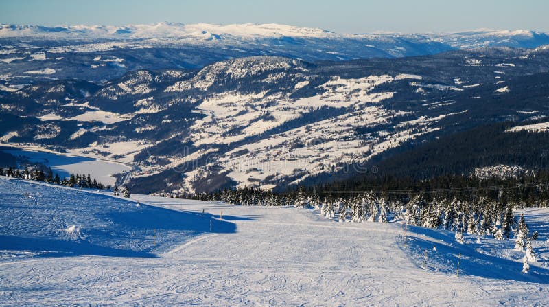 Empty downhill ski slopes at a popular ski resort