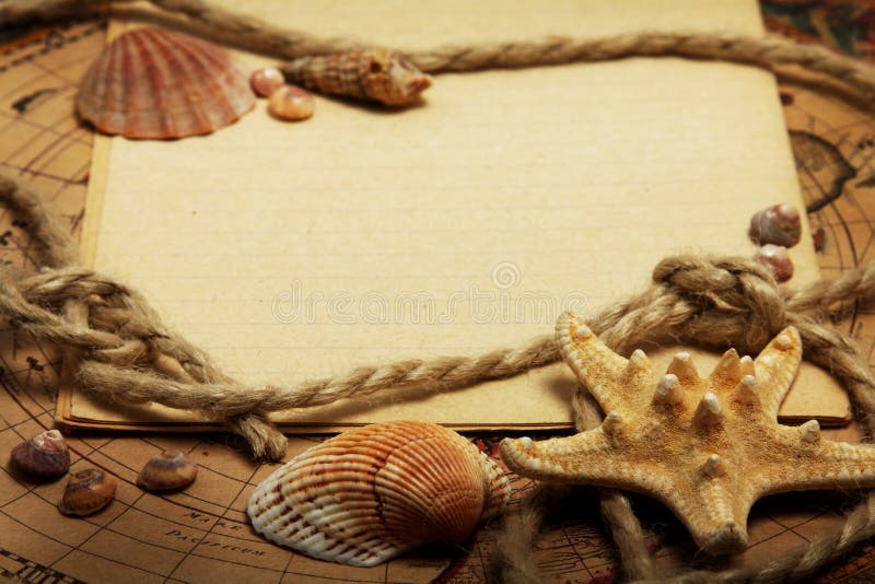 Empty exercise book, seashells and rope