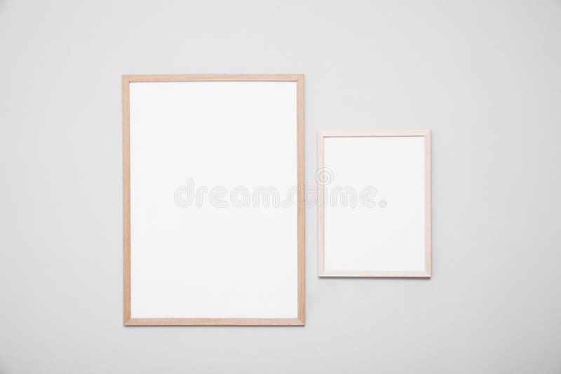 Empty Frames on Grey Wall. Mockup for Design Stock Photo Image of