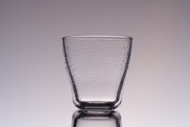 Empty water and juice glass stock image