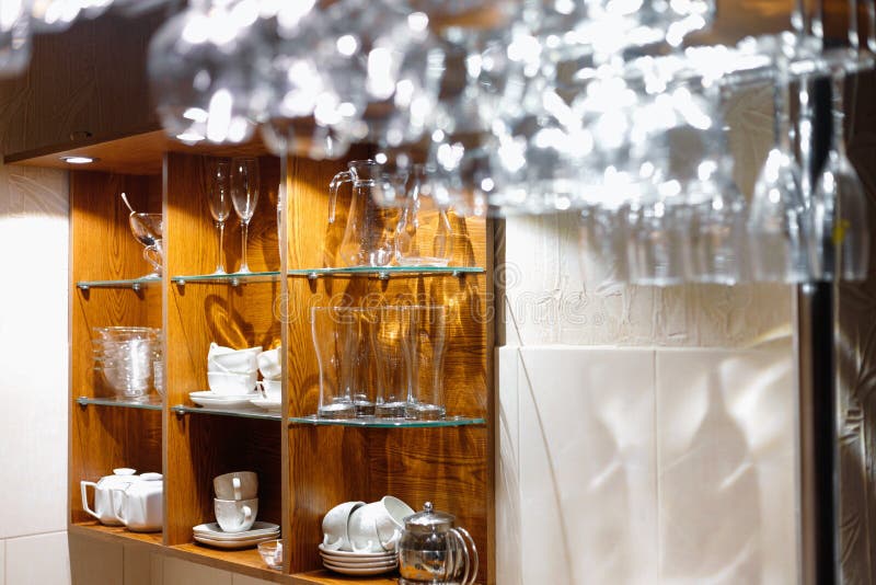 Empty Glasses Hanging Above the Bar in the Restaurant Stock Photo