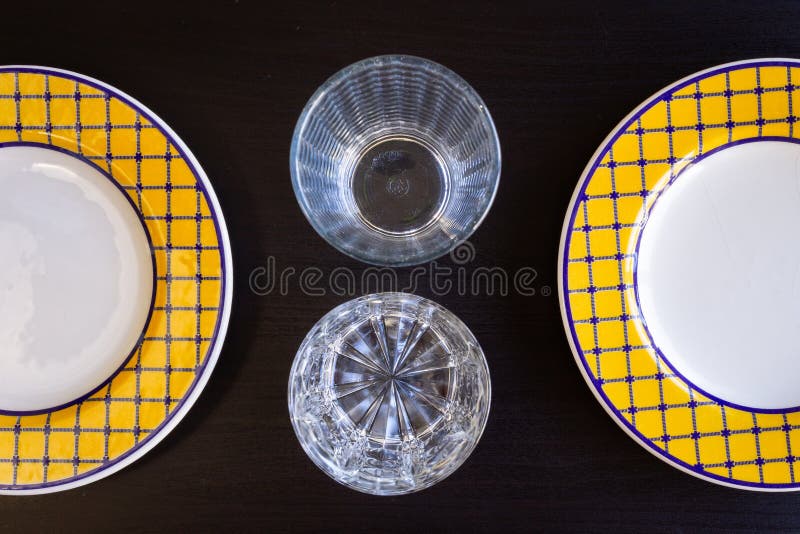 Empty Glasses and Plates on Black Wooden Background royalty free stock photos Empty Glasses and Plates on Black Wooden Background royalty free stock photos