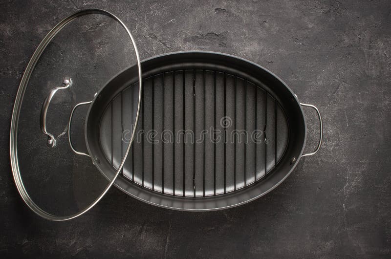 Empty Gray Nonstick Baking Dish with Handles on Dark Stone Surface