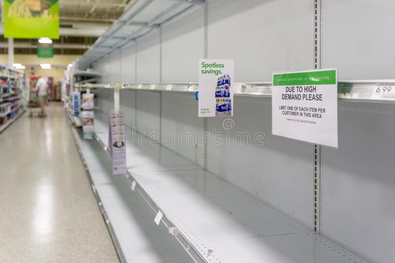 Empty grocery store shelves at Publix fully out of stock of all supplies including toilet paper, paper products, and bathroom