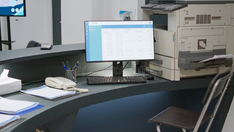 Empty hospital reception desk with checkup forms and reports stock photography