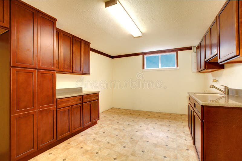 Empty Kitchen Room Interior with Wooden and Tile Floor. Stock