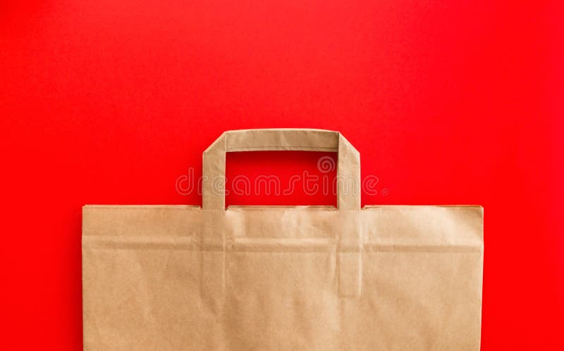 Download Empty Kraft Paper Bag On Red Background, Flat Lay ...