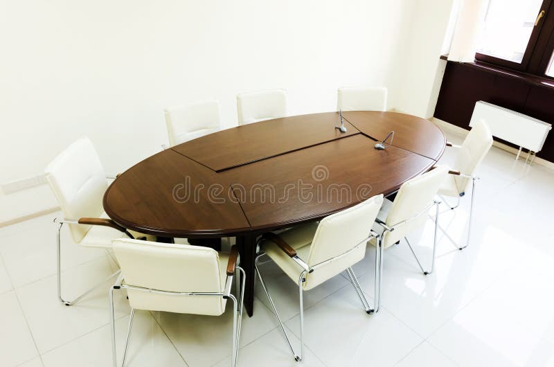 Empty lighting meeting room with long table royalty free stock photo