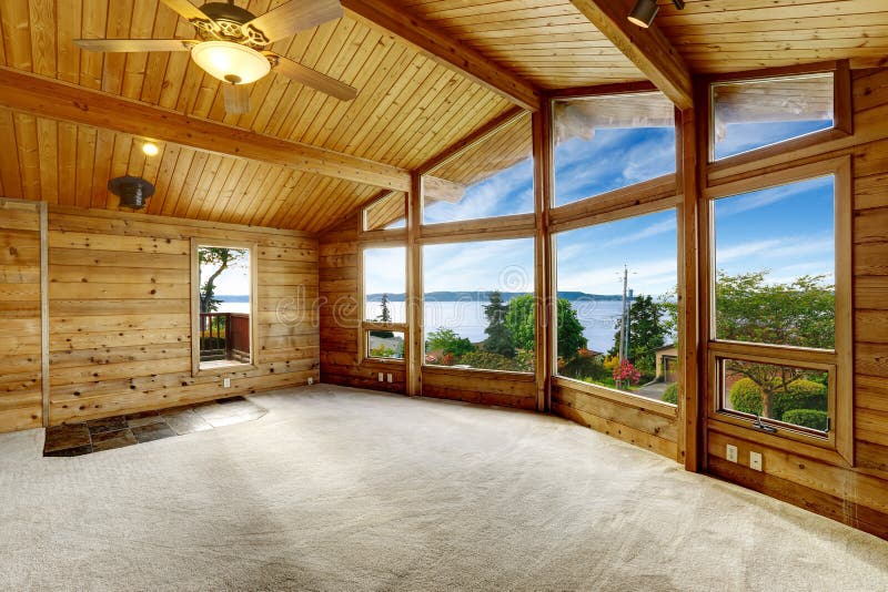 Empty living room with carpet floor in wooden trim house