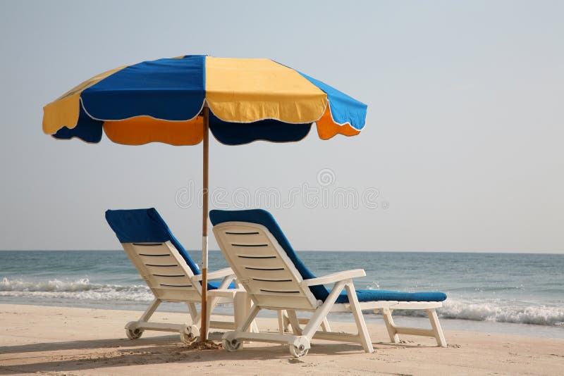 Empty lounge chairs on the beach