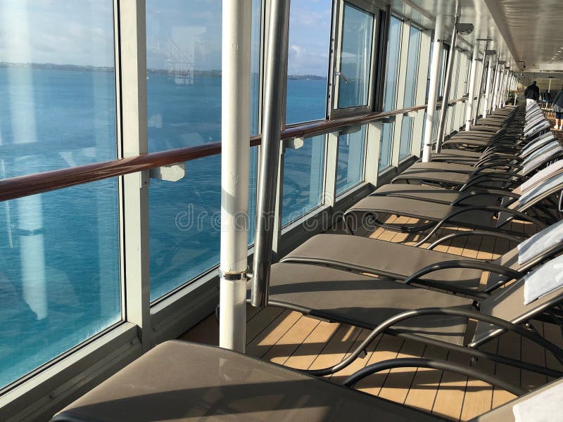 Lounge chairs on a cruise ship deck.