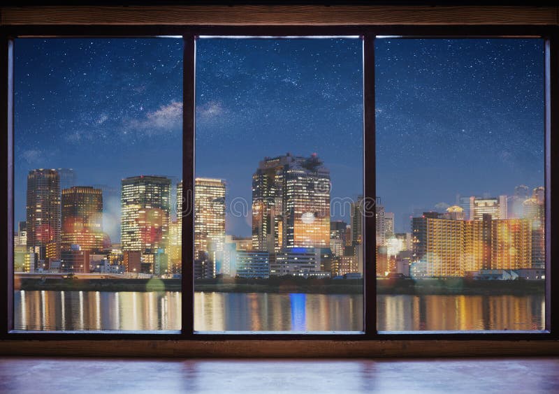 Empty modern interior space with city view at night and starry sky