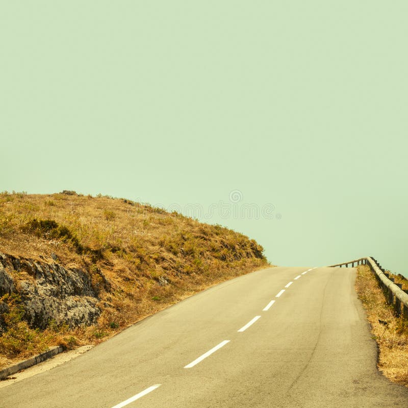 Empty mountain asphalt road and clear blue sky