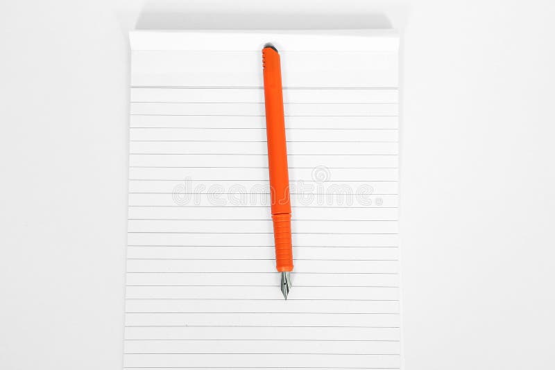 Empty notebook paper with pen. Isolated on the white background.