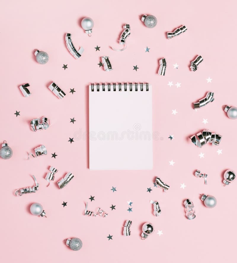 Empty Notebook on pink background with silver Christmas decoration. Bright and festive. New Year concept, top view, flat lay royalty free stock image Empty Notebook on pink background with silver Christmas decoration. Bright and festive. New Year concept, top view, flat lay royalty free stock image