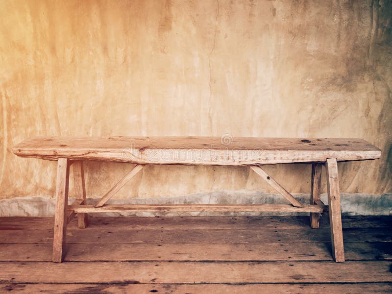 Empty old wood chair and cement wall vintage