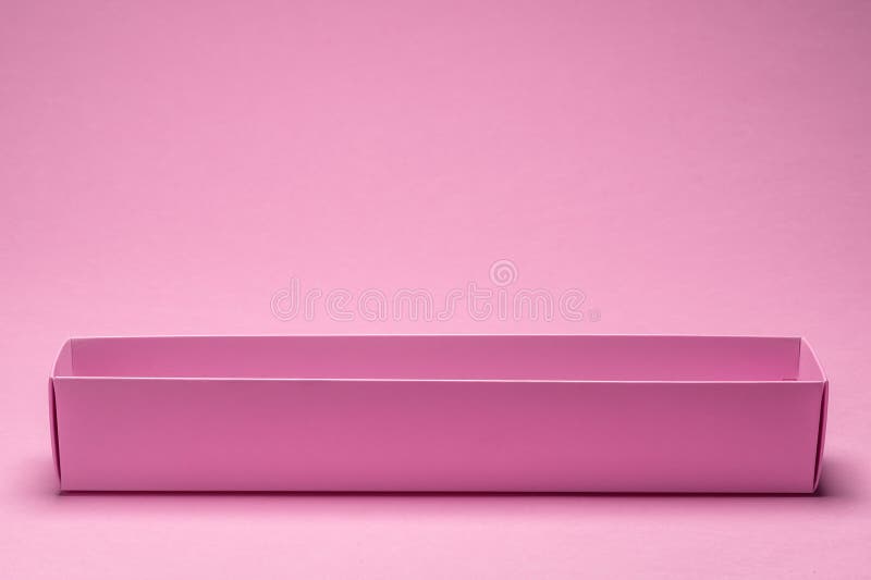 Empty open paper package box on pink background royalty free stock images