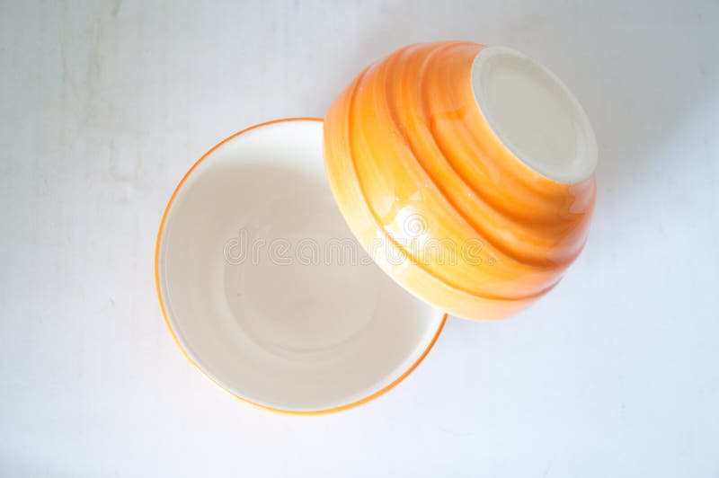Empty orange ceramic bowl stock image. Image of clay 63425607