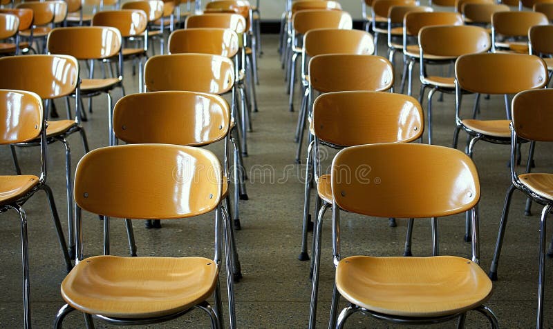 Empty orange chairs in rows in an auditorium, ready for an event or meeting stock illustration