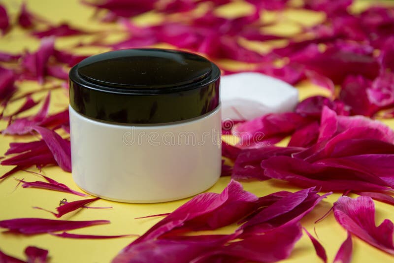 Download Jar With Cosmetic Cream, Facial Skin Care, Green Peony Leaves On Yellow Background, Copy Space ...